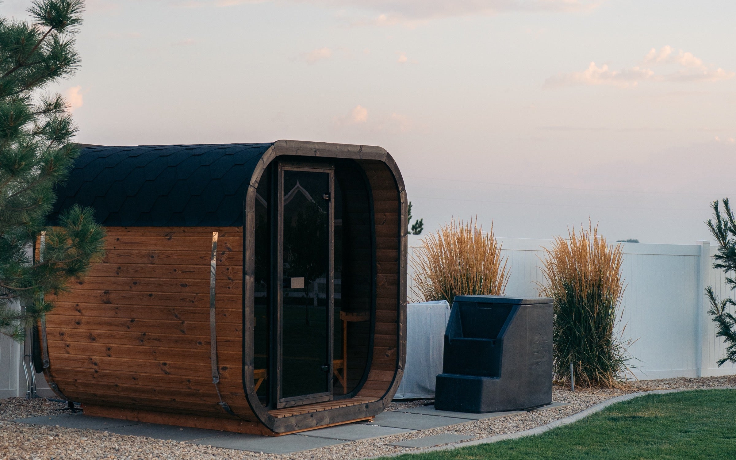 Western Sol barrel sauna in a backyard